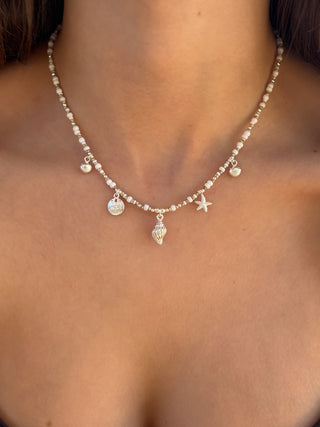 elegant summer charm necklace with sea shells and sandy beads.